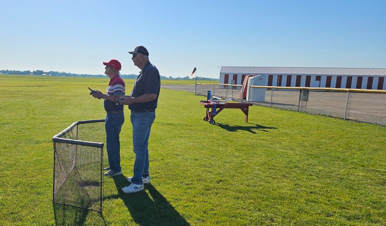 Instructor helping a student pilot learn to fly at the Converse Flying Eagles RC Club